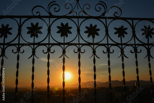 Iron fence at sunset