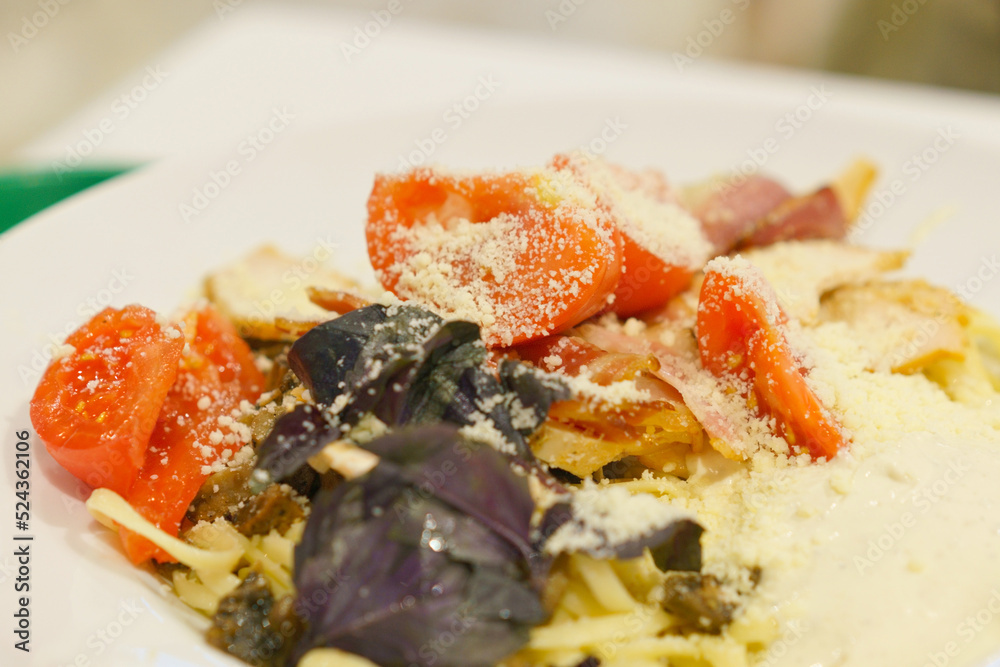 A plate of Italian tasty pasta with cheese, tomatoes, and sauce. Meal. Mushroom. Nourishment. Parmesan. Parmesan. Pasta. Plate. Ready-to-eat. Recipe. Restaurant. Sauce. Spaghetti. Substance A plate of Italian tasty pasta with cheese, tomatoes, and sauce. Meal. Mushroom. Nourishment. Parmesan. Parmesan. Pasta. Plate. Ready-to-eat. Recipe. Restaurant. Sauce. Spaghetti. Substance