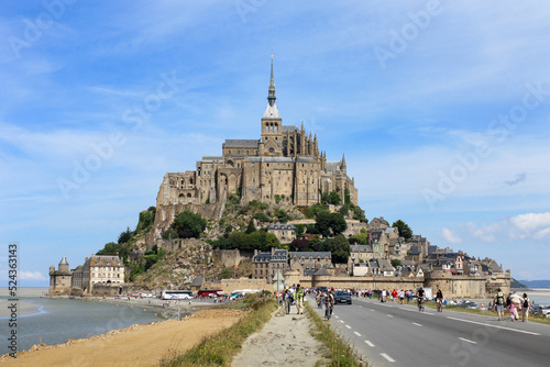 Beautiful panoramic view of famous Le Mont Saint-Michel tidal island with blue sky. Normandy, northern France