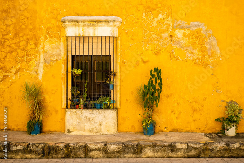 Typical old yellow house at the magical town of Izamal in Yucatan