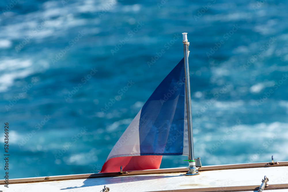Naklejka premium French flag, boat excursion to Calanques national park in Provence, France