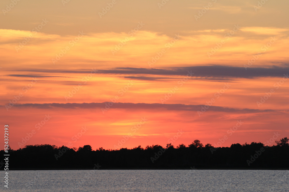 Brilliant sunset after glow on northern Minnesota lake