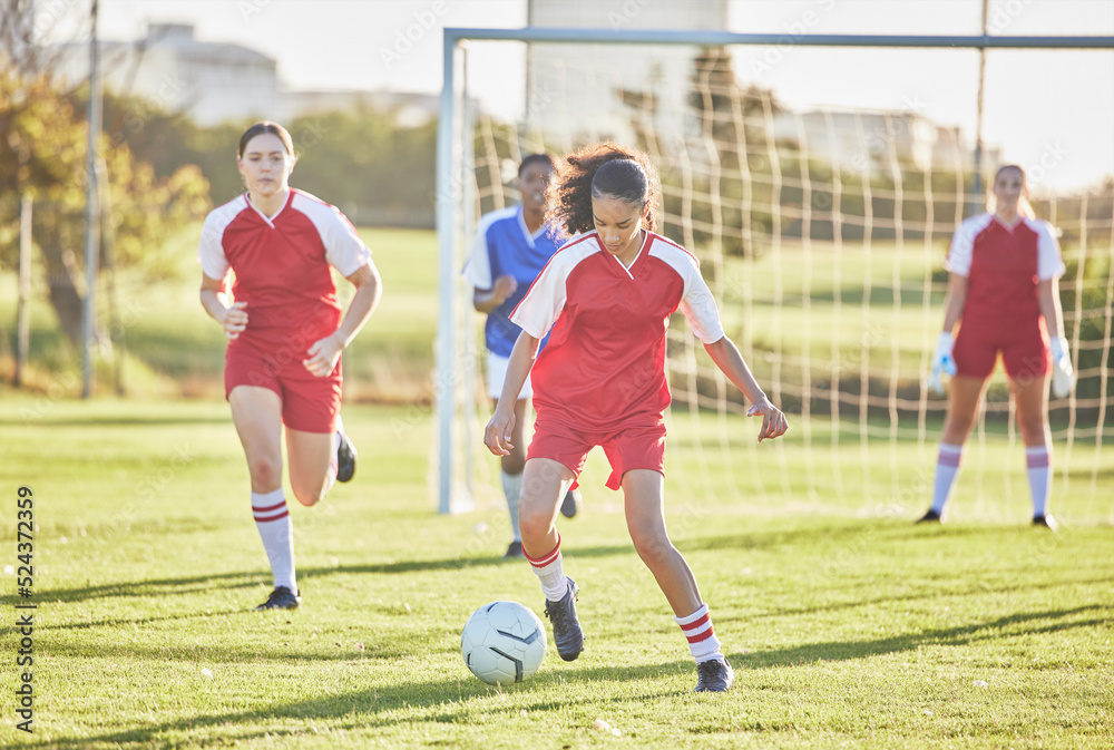 Fototapeta premium Female football, sports and girls team playing match on field while kicking, tackling and running with a ball. Energy, fast and skilled soccer players in a competitive game against opponents outdoors
