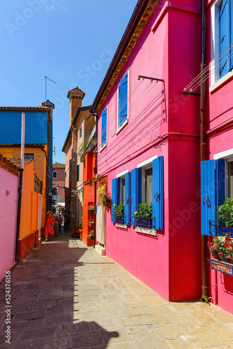 People walking in the village. Burano island, Venice, Italy.