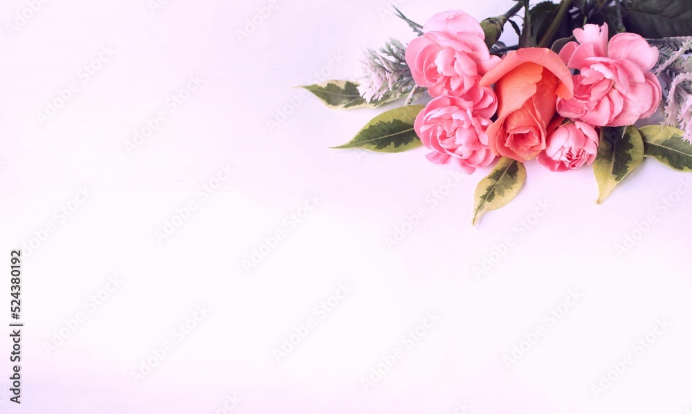 A bright bouquet with pink roses on a white background. Festive flower arrangement. Background for a greeting card.