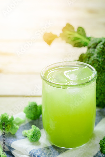 Glass of broccoli juice, broccoli Healthy drink on wood