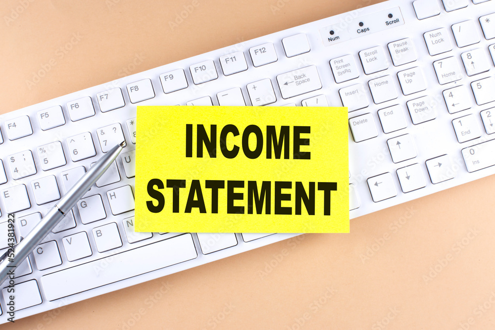 INCOME STATEMENT text on a sticky on keyboard, business concept INCOME STATEMENT text on a sticky on keyboard, business concept