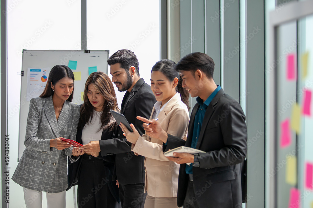 Business team male and female colleagues talking at work share ideas with data report in hands, Happy colleagues work together in office. Business team male and female colleagues talking at work share ideas with data report in hands, Happy colleagues work together in office.