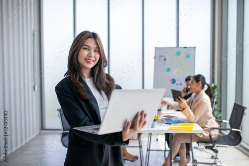 Portrait of Asian beautiful business woman working at the office, using computer. buiness concept.