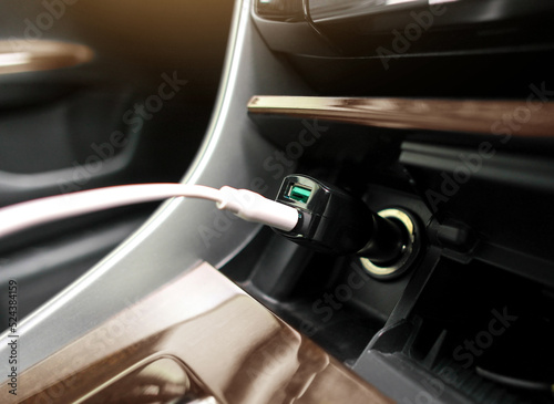 USB port charger for smartphone in a car. © BLKstudio