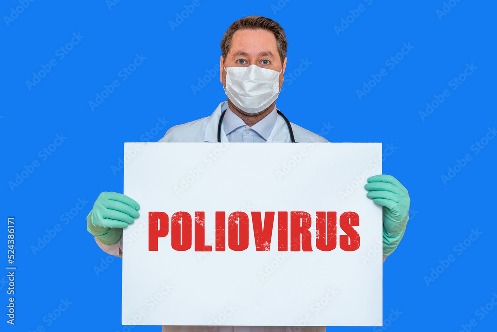 Inscription POLIOVIRUS.Doctor holds mockup.detection of poliomyelitis virus.New polio virus infects dozens in USA.Blue background. Inscription POLIOVIRUS.Doctor holds mockup.detection of poliomyelitis virus.New polio virus infects dozens in USA.Blue background.