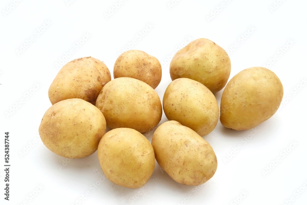 A pile of fresh organic baby potatoes, on white background.
A pile of fresh organic baby potatoes, on white background.