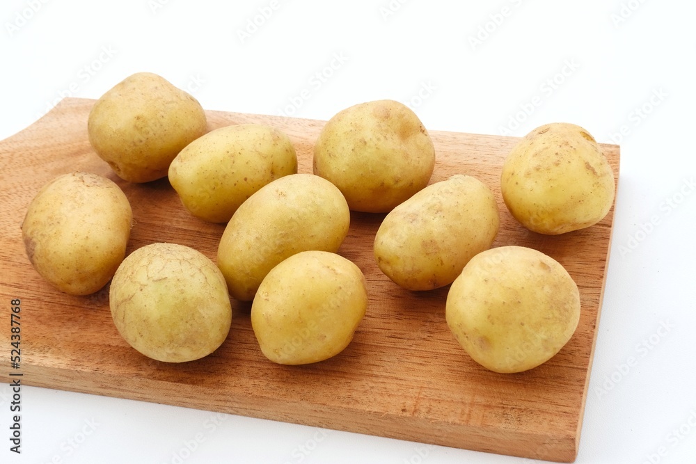 A pile of fresh organic baby potatoes, on white background.
A pile of fresh organic baby potatoes, on white background.
