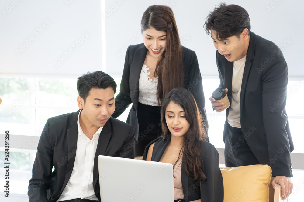 Happy office concept - concentrated business team with laptop computers in office. Happy Business team of entrepreneurs working together. Funny moment in business. Happy office concept - concentrated business team with laptop computers in office. Happy Business team of entrepreneurs working together. Funny moment in business.