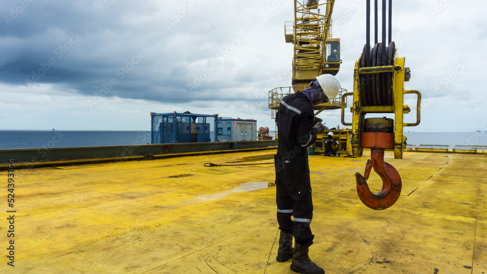 Mechanical engineer inspector is inspecting lifting equipment of