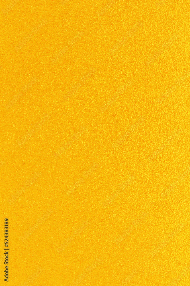 Naklejka premium Gold or yellow paint on cement wall texture background.