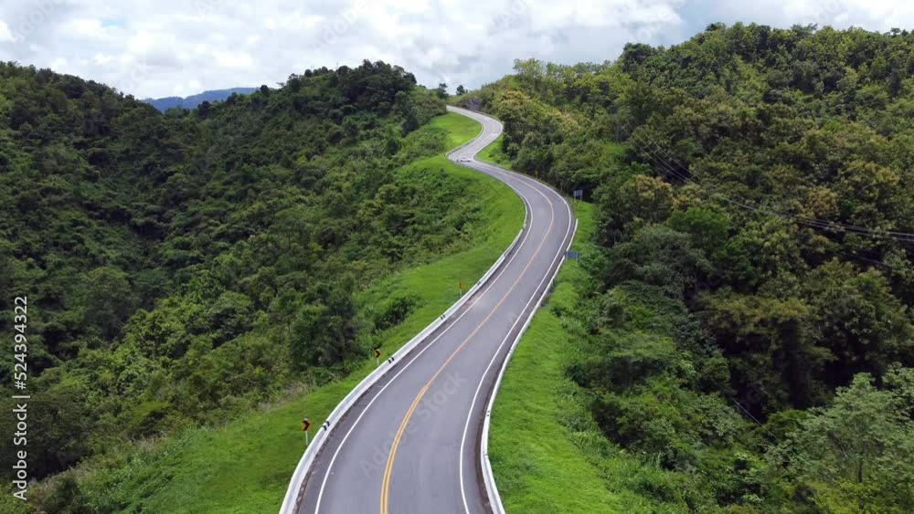 Aerial view of the road No.3 or sky road over top of mountains with green jungle in Nan province, Thailand. Aerial view of the road No.3 or sky road over top of mountains with green jungle in Nan province, Thailand.
