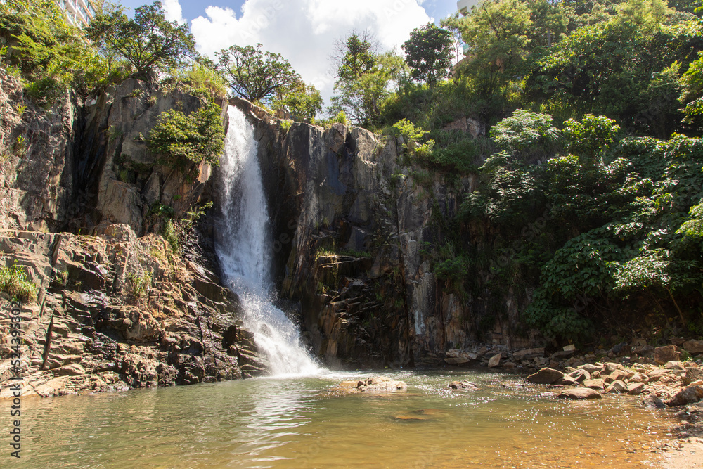 Fototapeta premium 2022 Aug 10,Hong Kong.Waterfall Bay in Pok Fu Lam, Hong Kong Island, Hong Kong.One of the Waterfall close to the city.