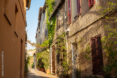 Fototapeta Naklejka Na Ścianę i Meble -  Sunny day in South of France, walking in ancient Provencal coastal town Cassis, narrow streets and colorful buildings, Provence, France