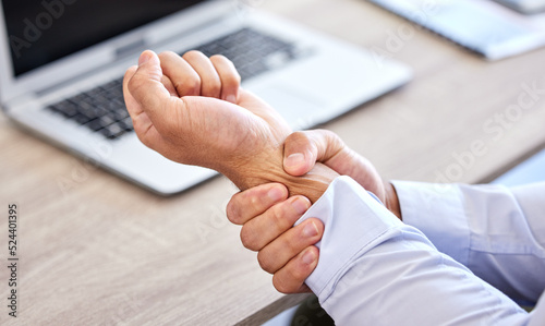 Photos Business man with bad wrist pain in the hand after an injury and ache while in the office