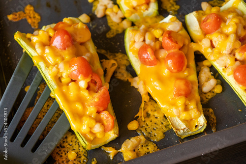 mediterranean food stuff zucchini with corn beans and cherry tomatoes with cheder cheese  photo