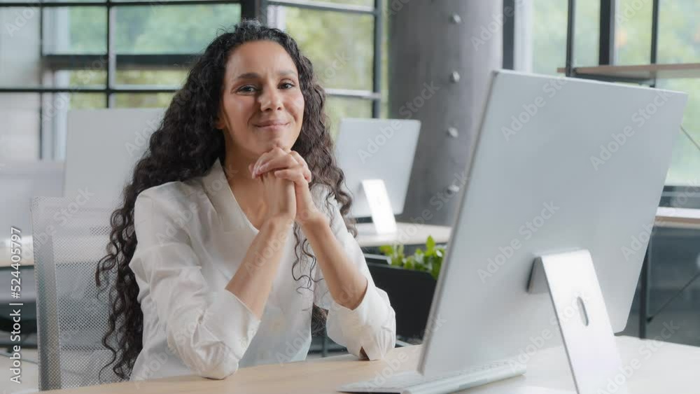Young pretty cute hispanic businesswoman sitting in office looking at camera happy confident girl entrepreneur model posing at workplace smiling presenting advertising successful business corporation Young pretty cute hispanic businesswoman sitting in office looking at camera happy confident girl entrepreneur model posing at workplace smiling presenting advertising successful business corporation