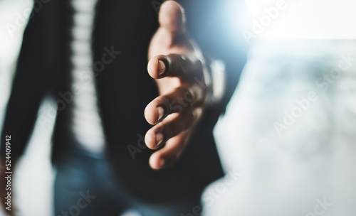 Handshake, welcome and greeting with a business man reaching out his hand to congratulate, promote or celebrate success. Closeup of teamwork, unity and togetherness with a corporate professional