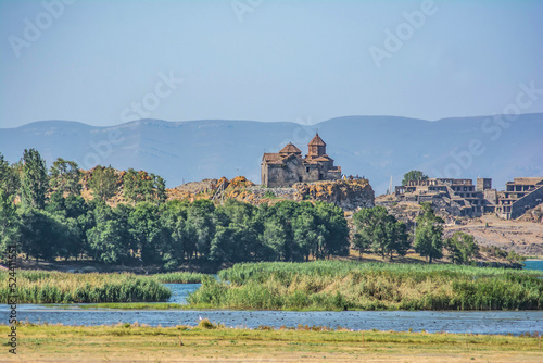 Church on the rock. Beautiful landscape with churches, lake and mountains. Churches by the lake. Apostolic monastery of Hayravank