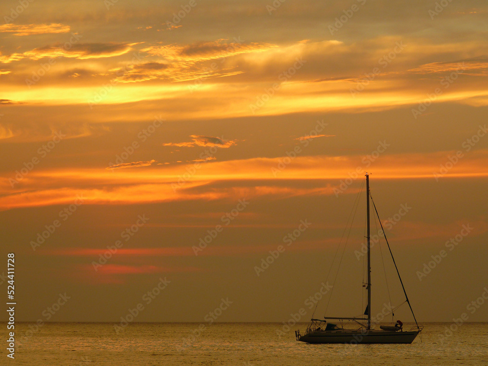 Yacht and clouds at sunset