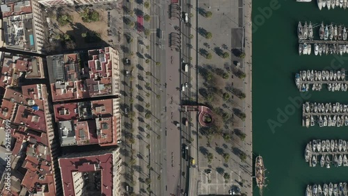 Top down shot of waterfront with Moll de Bosch i Alsina pedestrian zone in Port Vell in centre city. Barcelona, Spain photo