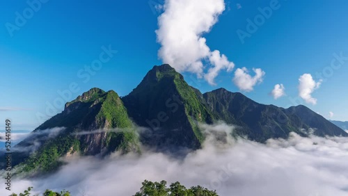 Time lapse of Beautiful view sea of fog in the morning forest mountain with green mountains. Nongkhiaw, Laos.  photo