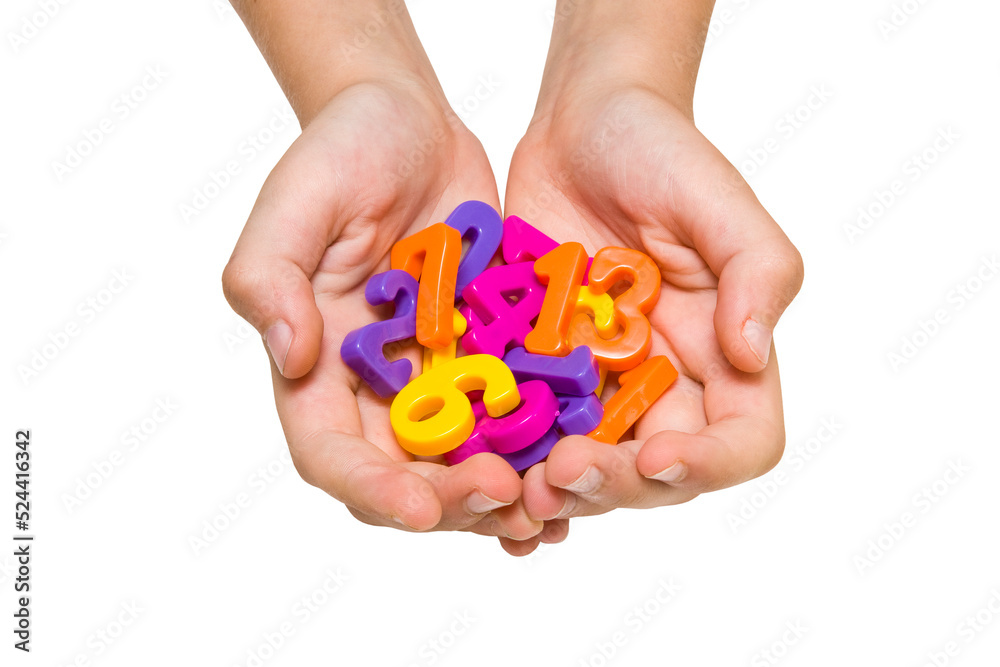 Child hands holding color plastic numbers Child hands holding color plastic numbers