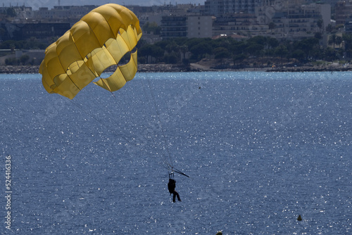 Parachut with speedboat people having fun photo