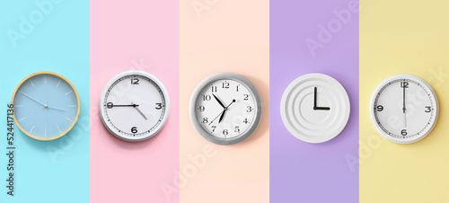 Valokuva Set of different clocks on colorful background