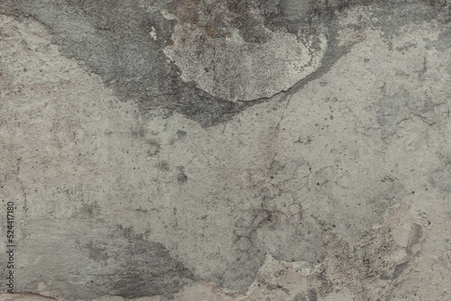 A concrete wall texture with cracks and scratches. Old cement wall, abstract grunge background.
