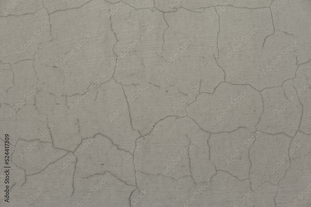 A concrete wall texture with cracks and scratches. Abstract background, old cement wall. A concrete wall texture with cracks and scratches. Abstract background, old cement wall.