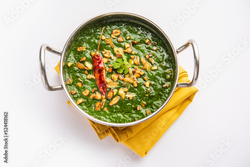 lasooni palak recipe or dhaba style garlic spinach curry, Indian main course served with naan photo