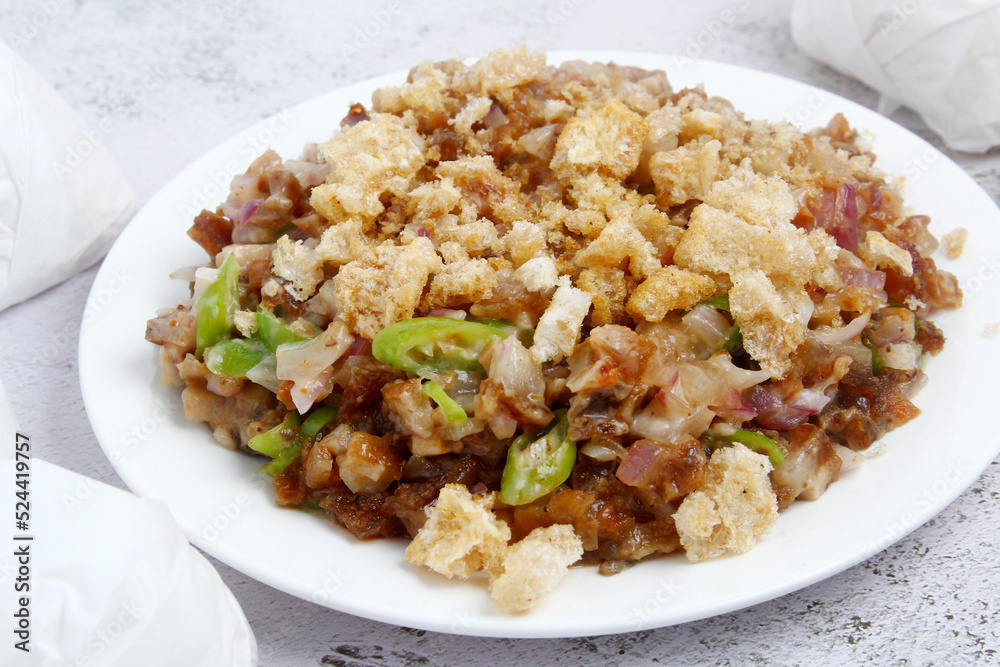 Freshly cooked Filipino food called Pork Sisig Freshly cooked Filipino food called Pork Sisig