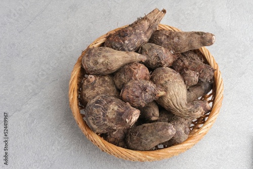 Taro, Talas belitung, kimpul or bentul, are starchy tubers that can be eaten. Served boiled or steamed. photo