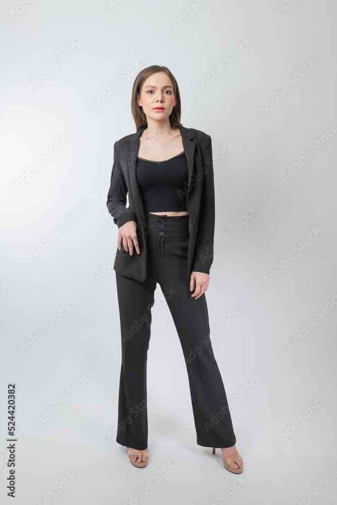Full length body portrait of a young beautiful asian female businesswoman wearing full black business attire and pose with different gestures & emotions. Suitable for business presentation or slides. Full length body portrait of a young beautiful asian female businesswoman wearing full black business attire and pose with different gestures & emotions. Suitable for business presentation or slides.