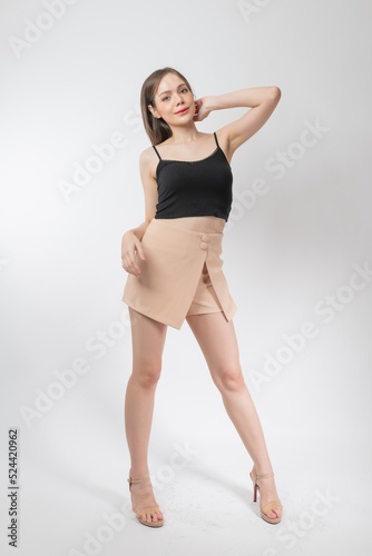 Full length body portrait of a young beautiful asian female business executive wearing stylish friday attire and pose with different gestures & emotions. Suitable for business presentation or slides © asean studio