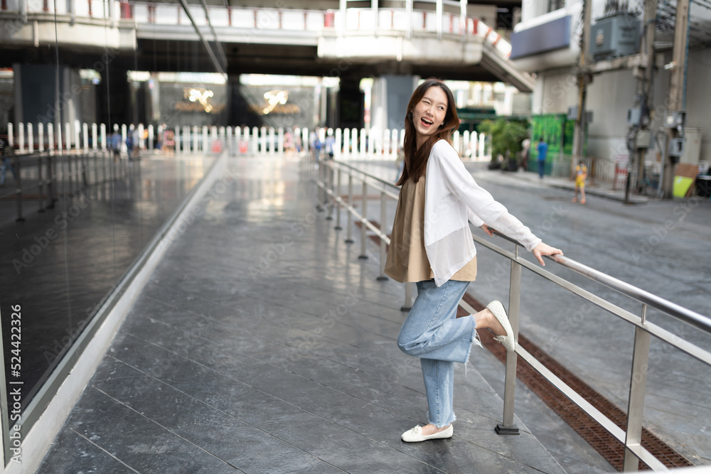Lifestyle portrait photo of a beautiful young asian lady relax and posing around the city after a long pandemic lockdown Lifestyle portrait photo of a beautiful young asian lady relax and posing around the city after a long pandemic lockdown