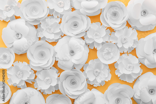 Paper flowers on yellow bac...
