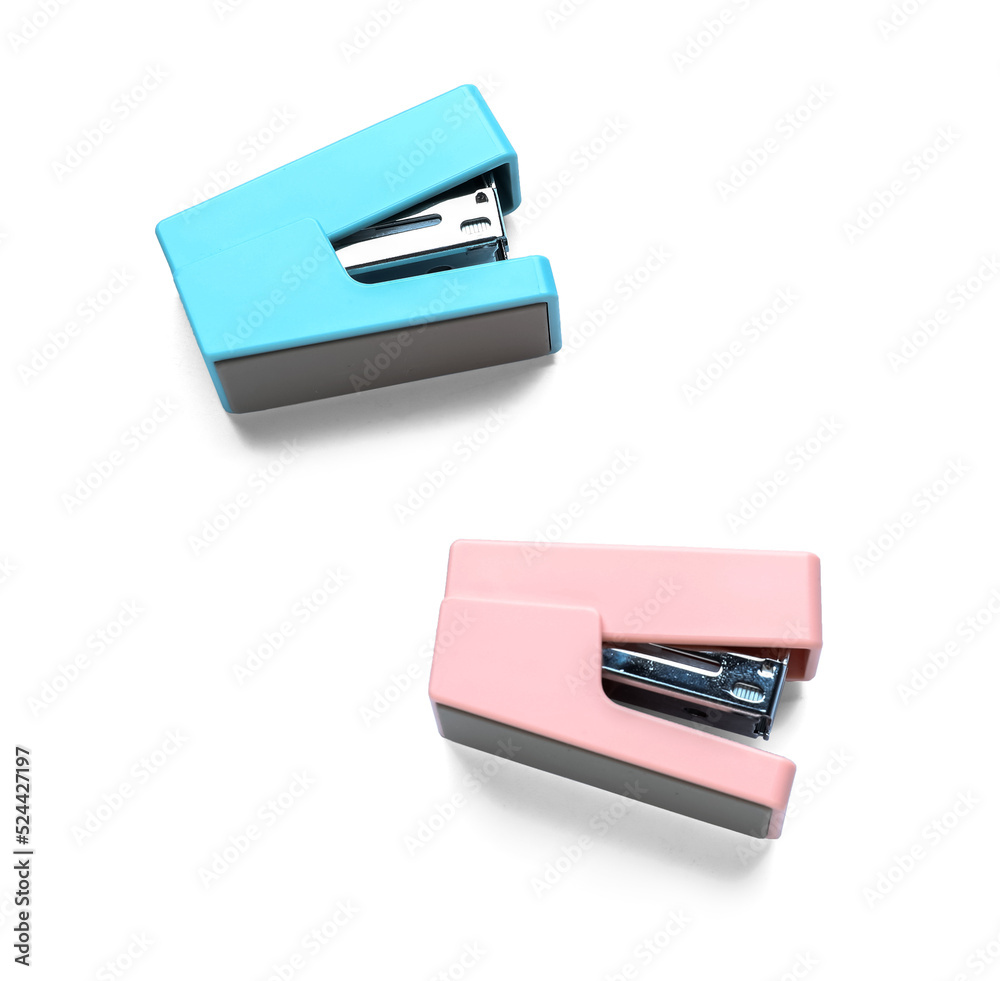 Two colorful staplers on white background Two colorful staplers on white background