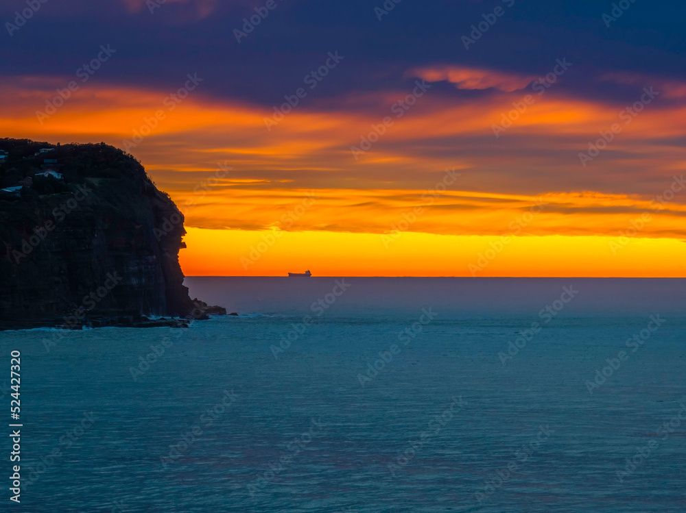 Cloud filled sunrise seascape