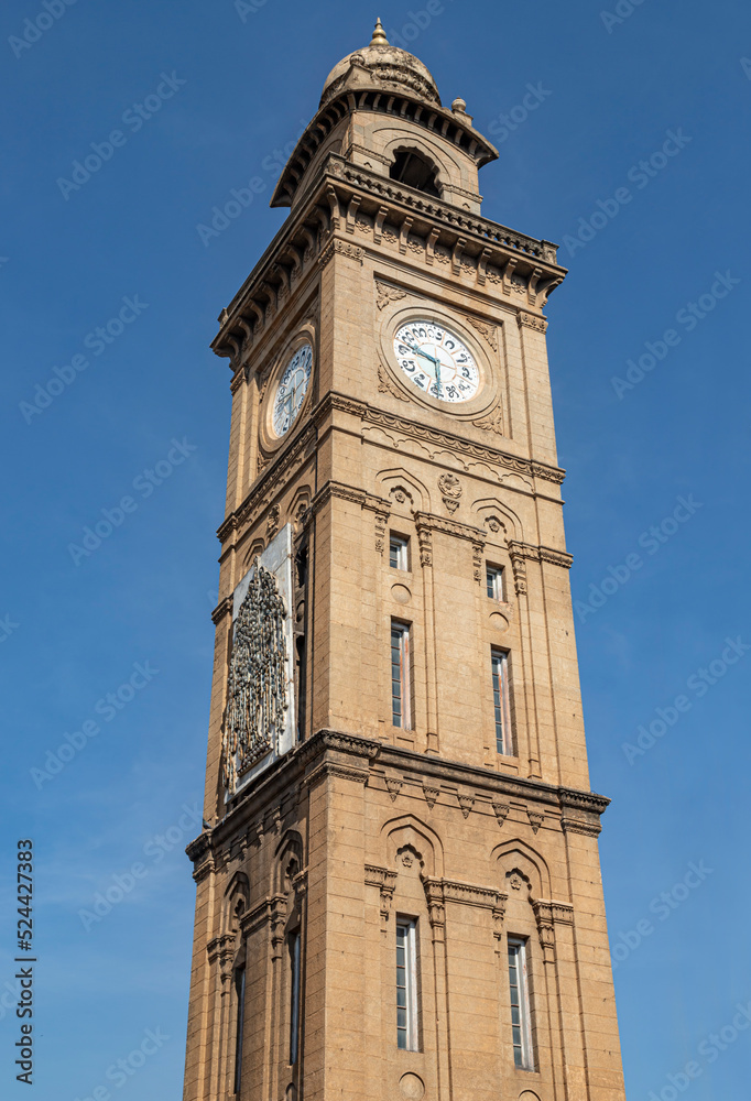 100 year old Indo-Saracenic Clock Tower (known as Dodda Gadiaya or Silver Jubilee Clock Tower) with numerals in Kannada language at Mysore, Karnataka, India