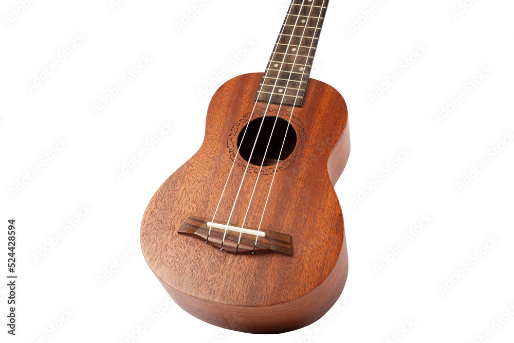 Wooden ukulele guitar isolated over white background. Wooden ukulele guitar isolated over white background.