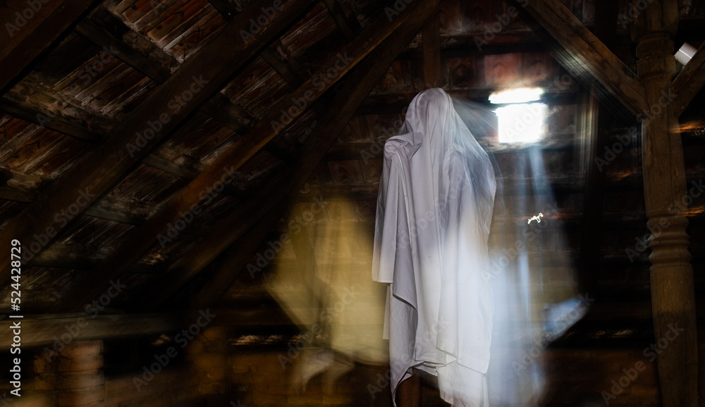 blurred image of ghost in the attic haunted house for Halloween