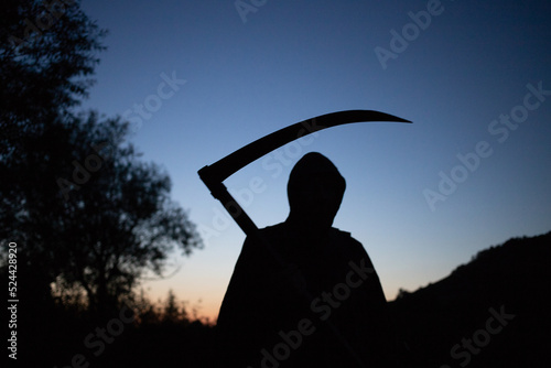 grim reaper, the death itself, scary horror shot of Grim Reaper holding scythe