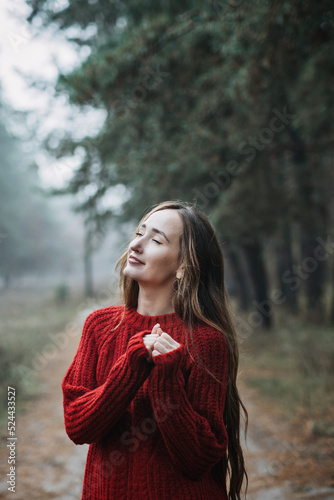 Mindfulness-based cognitive therapy, Mindfulness practices. Young woman with long hair relaxing in forest